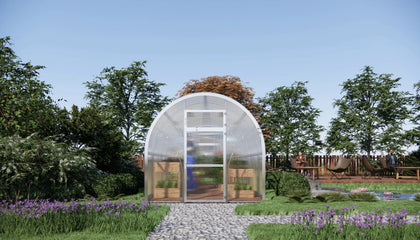 Sigma 250 (Gen III) greenhouse in a garden with trees and flowers around