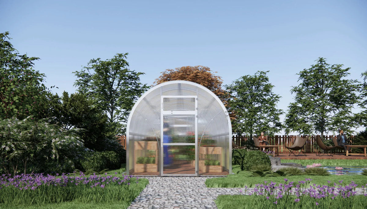 Sigma 250 (Gen III) greenhouse in a garden with trees and flowers around