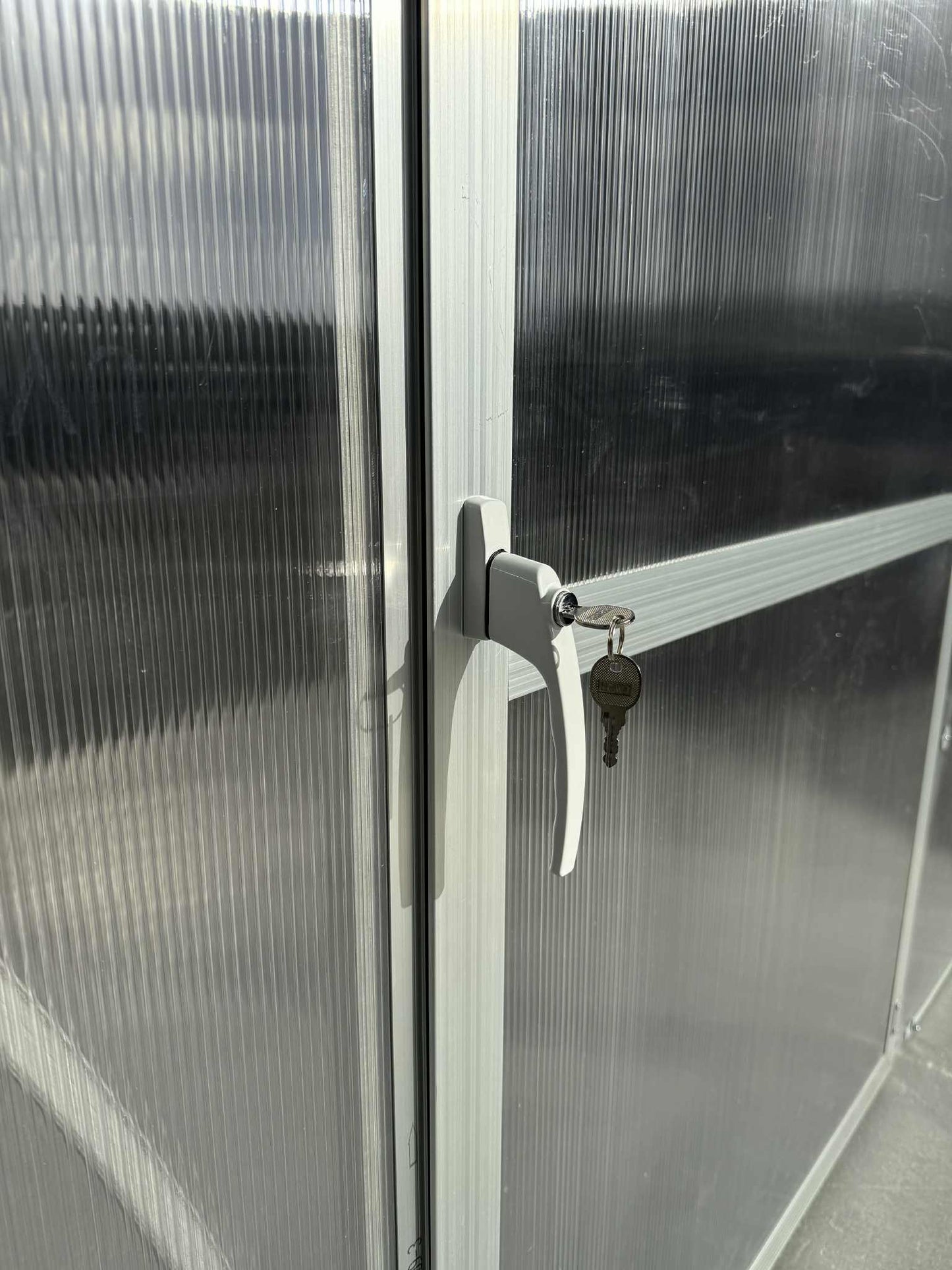 A door closeup of a  Sigma 300 (Gen III) greenhouse.